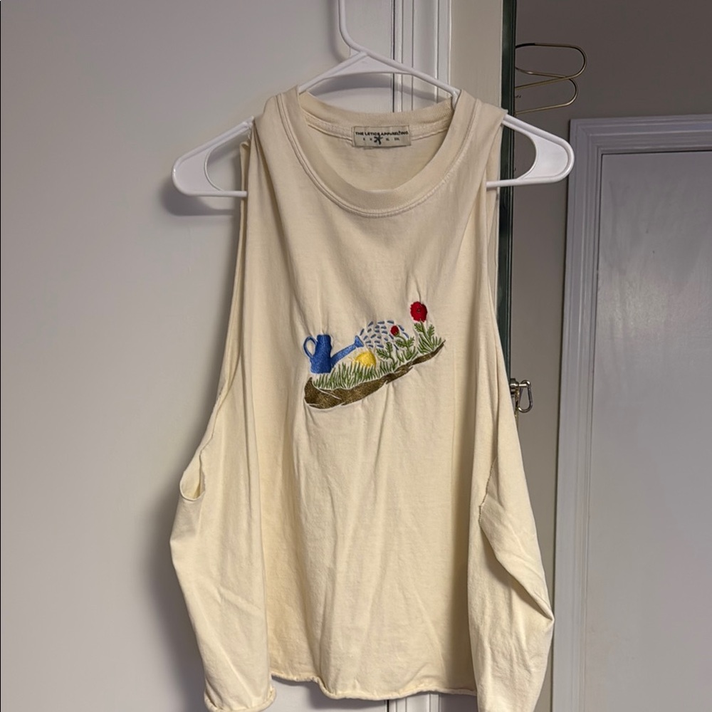 Cream Sleeveless Top with Embroidered Design